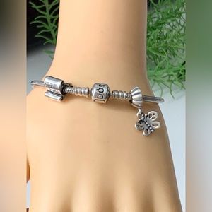 Authentic Pandora Charm Bracelet With 2 charms 7.1/2”